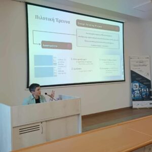 A photo of Charikleia Korompli presenting a Design Thinking Project in a lecture room.
